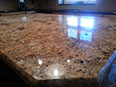 Gold and Silver granite island with Black Pearl granite perimeter - two-tone kitchen with complementary colors