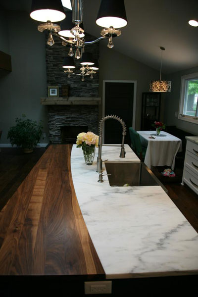 imperial danby marble countertop with butcherblock dining bar and farm sink