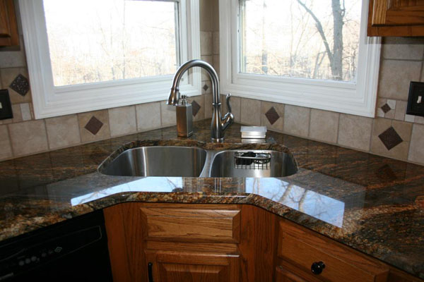 blue fire granite countertops in kitchen with corner sink