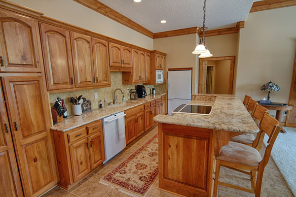 kitchen design with light wood cabinets and revelation granite countertops with bullnose edge